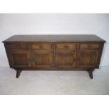 An oak sideboard with linen fold decoration