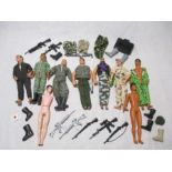 An assortment of vintage Action Man figures, along with a selection of Action Man accessories