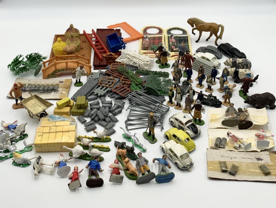 A collection of farmyard and other model items including a large number of Britains and a small