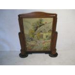 An Art Deco fire screen with tapestry inset