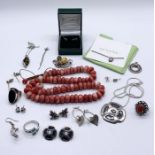 A collection of 925 silver jewellery including necklaces, rings etc. along with a coral necklace