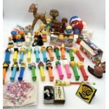 An assortment of toys and collectables including Matchbox ball bearing toys, Pez character