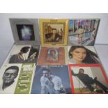 A small collection of 12" vinyl records including The Commodores, Tears for Fears, Madonna, Diana