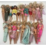A collection of various vintage Barbie dolls
