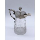 A silver plated and cut glass whiskey tot/oil jug