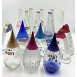 A collection of 14 limited edition Evian glass water bottles including designs by Issey Miyake,