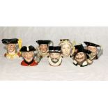 A collection of seven Royal Doulton character jugs relating to British History, including Queen