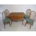 A Priory oak drop leaf table in the style of Ercol with four matching chairs