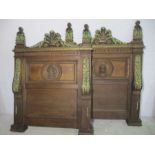 A pair of carved oak continental bed heads.