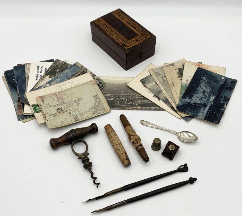 A collection of interesting items including Holborn Signet corkscrew, numerous postcards including a