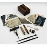A collection of interesting items including Holborn Signet corkscrew, numerous postcards including a