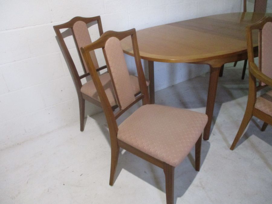 A Nathan extending dining table, along with six matching chairs including two carvers. - Image 4 of 16