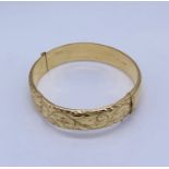 A 9ct gold hinged bracelet, weight 14.9g