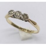 A 9ct gold and platinum diamond three stone ring