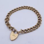 A 9ct rose gold curb bracelet with padlock (padlock 15ct), total weight 15.5g