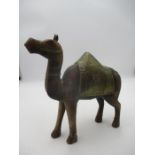 A wooden Camel with brass saddle.