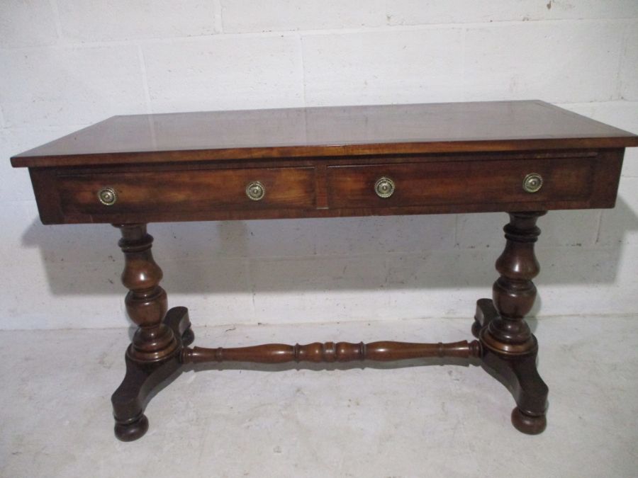 An early Victorian mahogany hall table with two drawers and turned legs