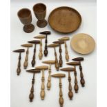 A collection of treen including a number of hand turned tools all created in different woods