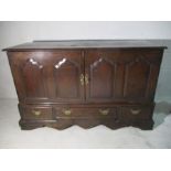 An antique converted oak mule chest with three drawers