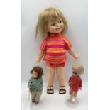 A 1966 Giggles doll along with an early Amanda Jane doll in original outfit and one other