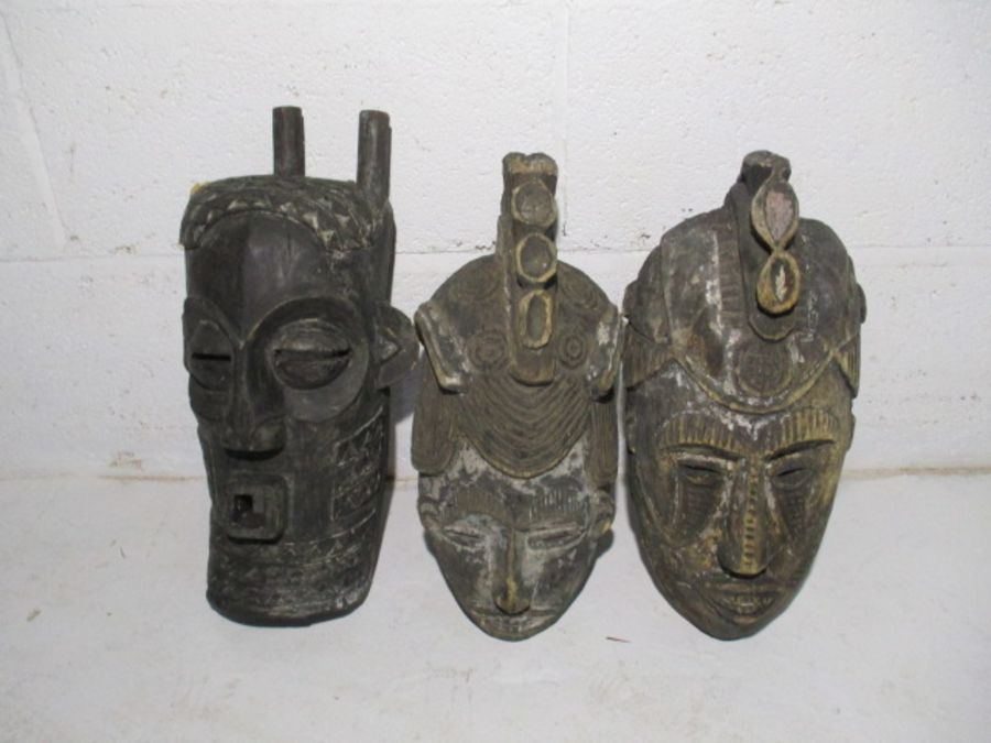 A collection of three vintage wooden African masks - one A/F