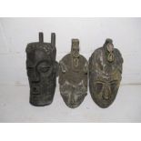 A collection of three vintage wooden African masks - one A/F