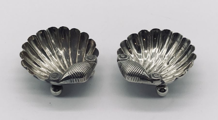 A pair of hallmarked silver shell shaped salts