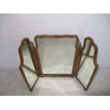 A walnut veneered triptych dressing table mirror.