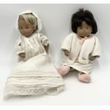 Two Sasha baby dolls, one blonde in long dress similar to a christening gown the other brunette