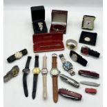 A collection of various watches, penknives etc.