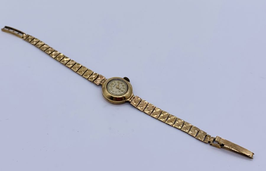 A ladies 9ct gold Bernex watch with 9ct gold strap, total weight 13.3g