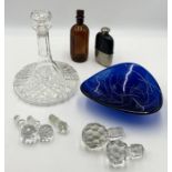 A collection of various glassware etc including ships decanter, various decanter stoppers, art