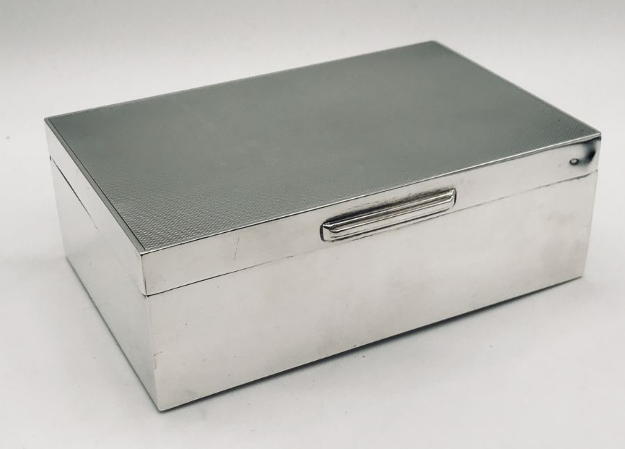 A hallmarked silver cigarette box