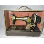 A Frister & Rossmann sewing machine, serial number 1421802 in carry case ( case A/F)