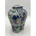 A Chinese vase with vine and foliage decoration and four character mark to base