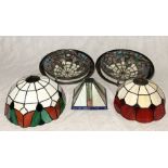 A collection of various Tiffany style glass shades