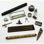 An interesting collection of items including vintage measuring stick, silver collared scent bottle