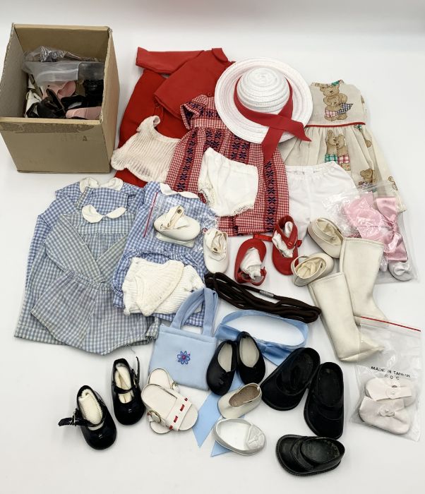 A collection of Sasha Doll clothes, shoes and outfits