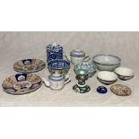 A collection of Oriental china including tea pots, Imari plates etc