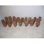 A quantity of small terracotta garden pots