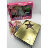 A small collection of Barbie doll sets and vintage dolls including Barbie as Scarlett O'Hara boxed