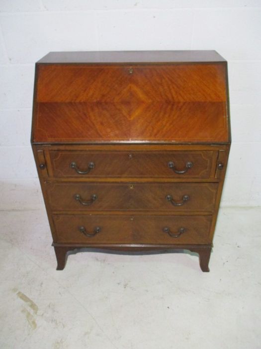 An Edwardian inlaid bureau