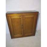 An oak two door cupboard