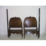 A pair of "Vono" walnut Edwardian single beds with cabriole legs
