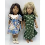 Two unboxed Sasha dolls one Blonde hair in a green dress the other Brunette with a gingham dress
