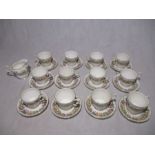 A set of twelve Paragon "Country Lane" cups and saucers, along with matching creamer jug