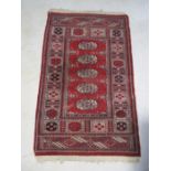 An Eastern red ground rug