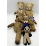 A collection of vintage teddies including a musical bear