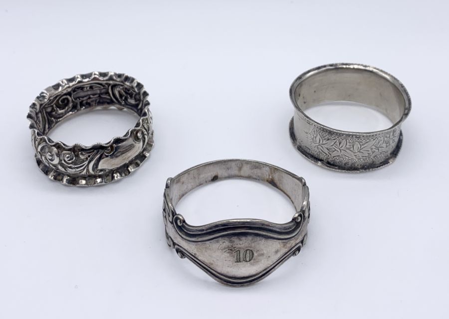A collection of 7 hallmarked silver napkin rings along with an Australian silver plated version - Image 5 of 5