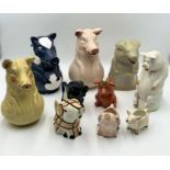 A collection of pig formed jugs including a Sarreguemines majolica ceramic jug along with a number
